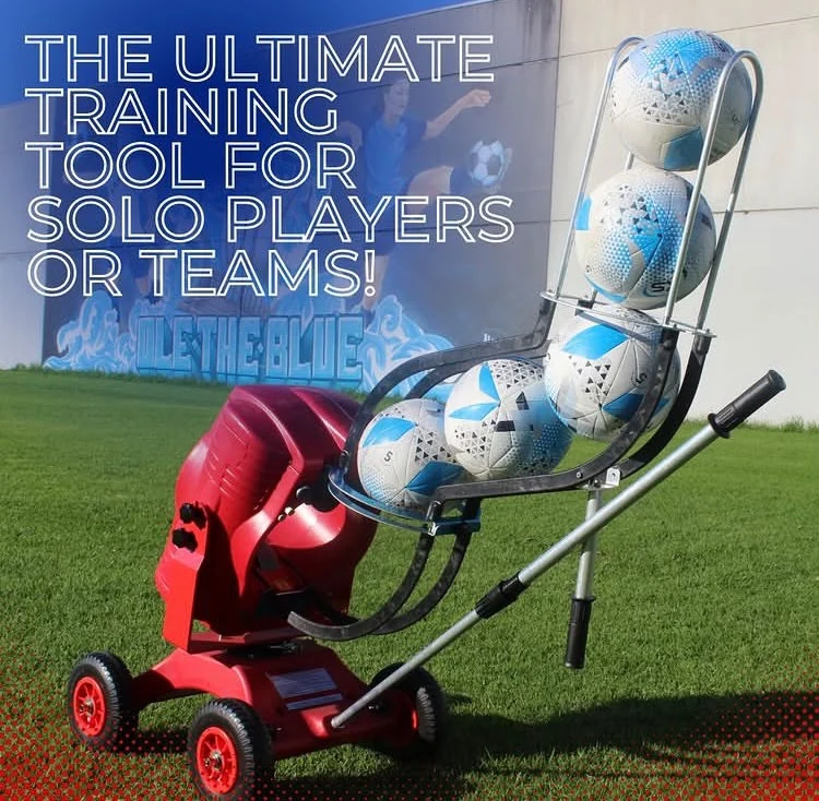 Red POWAPASS machine with a curved chute of footballs on grass, with solo and team training wording